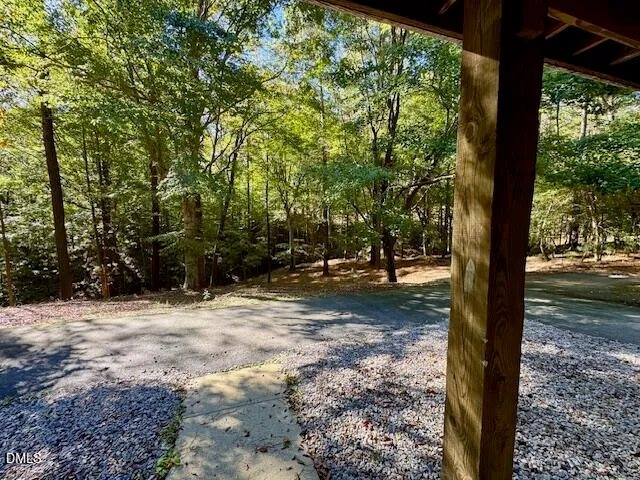 a view of bedroom with furniture and a window