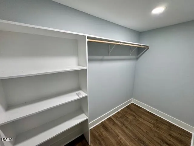 a front view of house with yard and trees around