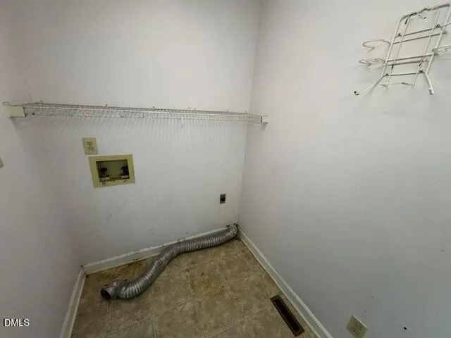 a view of a patio with table and chairs under an umbrella