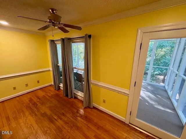 a view of a room with wooden floor