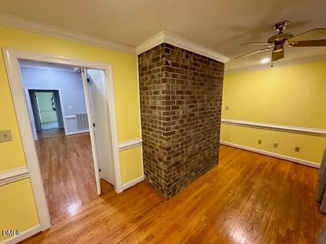 a view of walk in closet with wooden floor