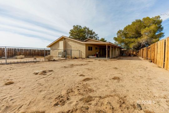 348 South Locust Street Ridgecrest, CA 93555 - Photo 21 of 21 a view of a house with a yard covered with snow in front of house