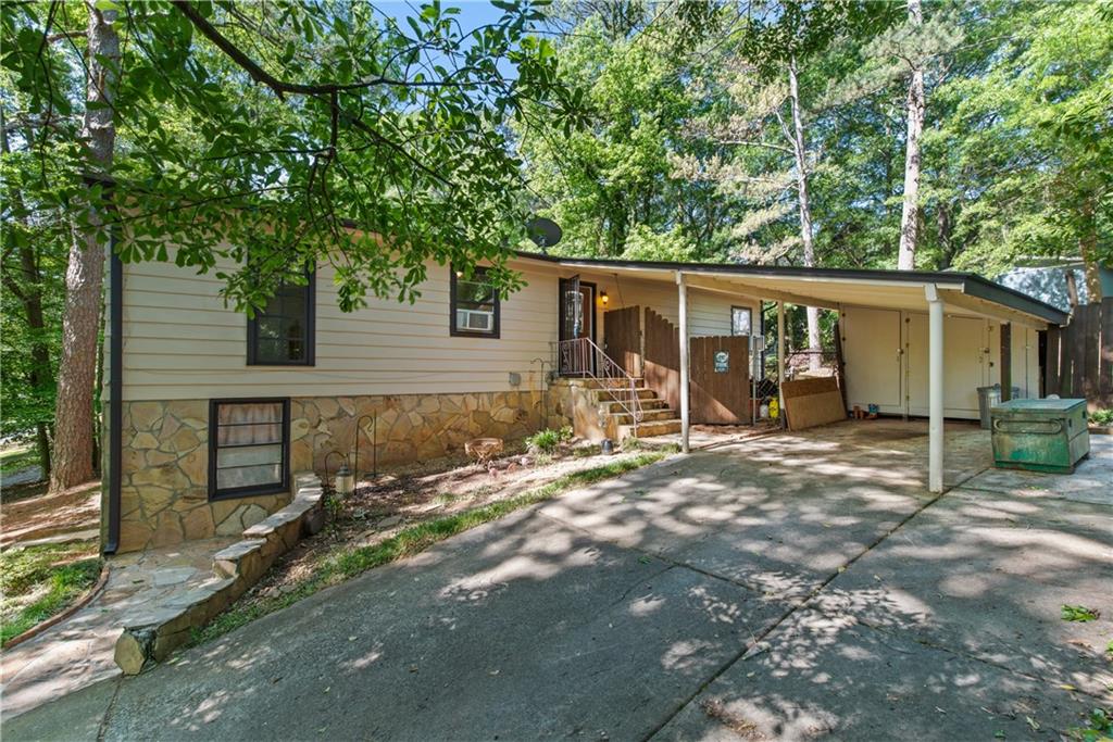 1256 Sparrow Lane Decatur, GA 30033 - Photo 1 of 1 a view of a backyard with a large tree