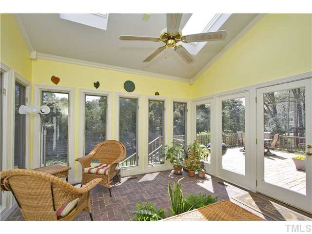 1105 Carlow Court Raleigh, NC 27615 - Photo 7 of 23 Looking out over the large deck and beautiful backyard and enjoying the peace of nature. Sun Room