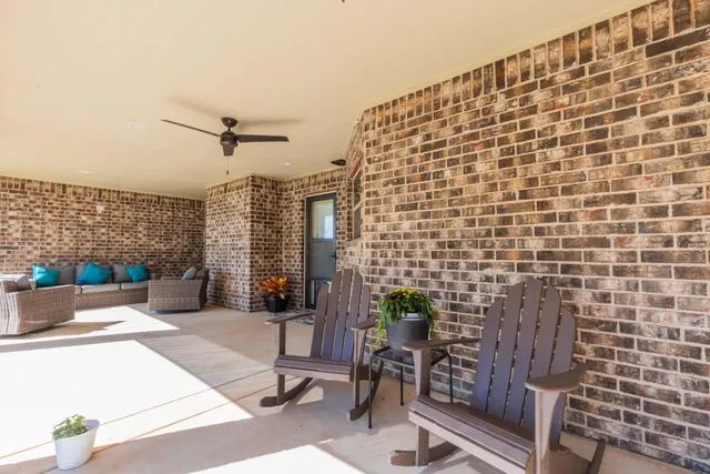 a patio with table and chairs