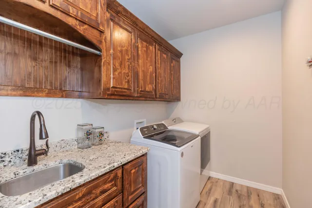 a big yard with large trees and plants