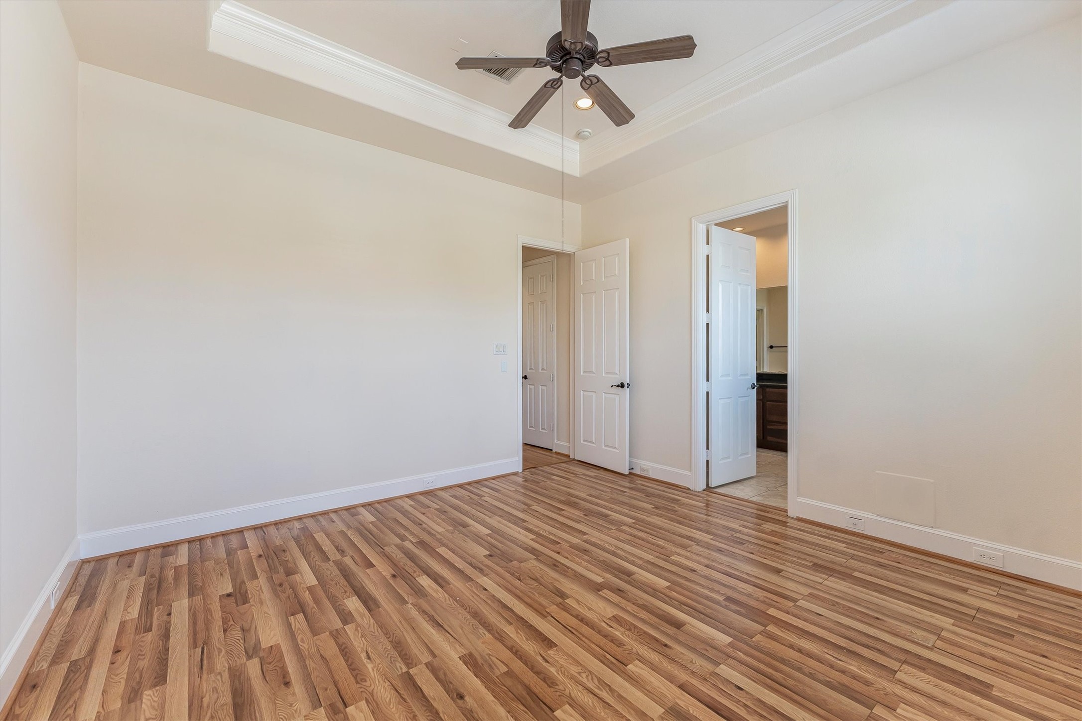 308 Grove Street Houston, TX 77020 - Photo 19 of 28 a view of room with wooden floor and ceiling fan