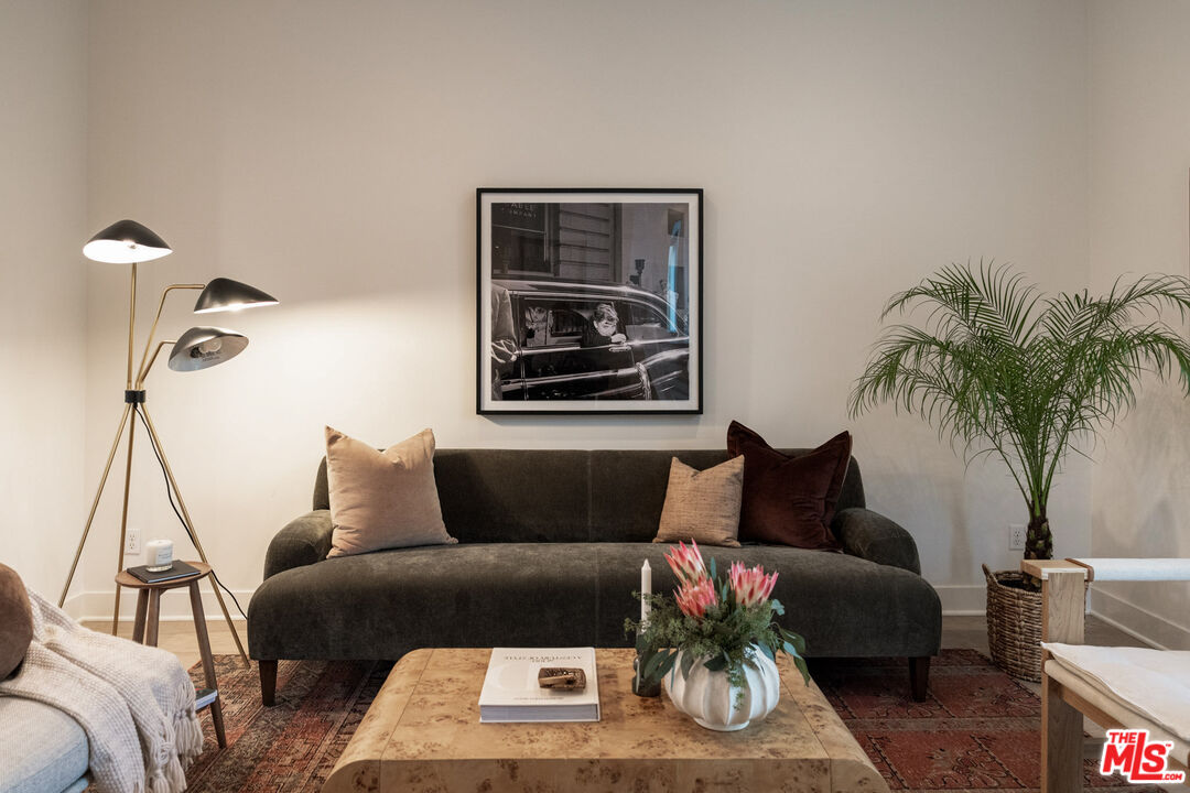 2210 Tom Mix Road Los Angeles, CA 90026 - Photo 1 of 45 a living room with furniture and a potted plant
