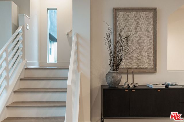 a view of staircase with white walls