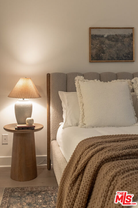 2210 Tom Mix Road Los Angeles, CA 90026 - Photo 19 of 45 a bedroom with a bed and painting on the wall