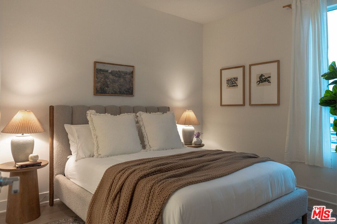 2210 Tom Mix Road Los Angeles, CA 90026 - Photo 20 of 45 a bedroom with bed and a night stand