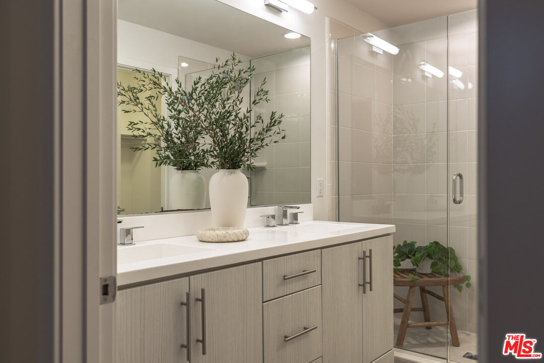 2210 Tom Mix Road Los Angeles, CA 90026 - Photo 23 of 45 a bathroom with a sink a vanity and a mirror