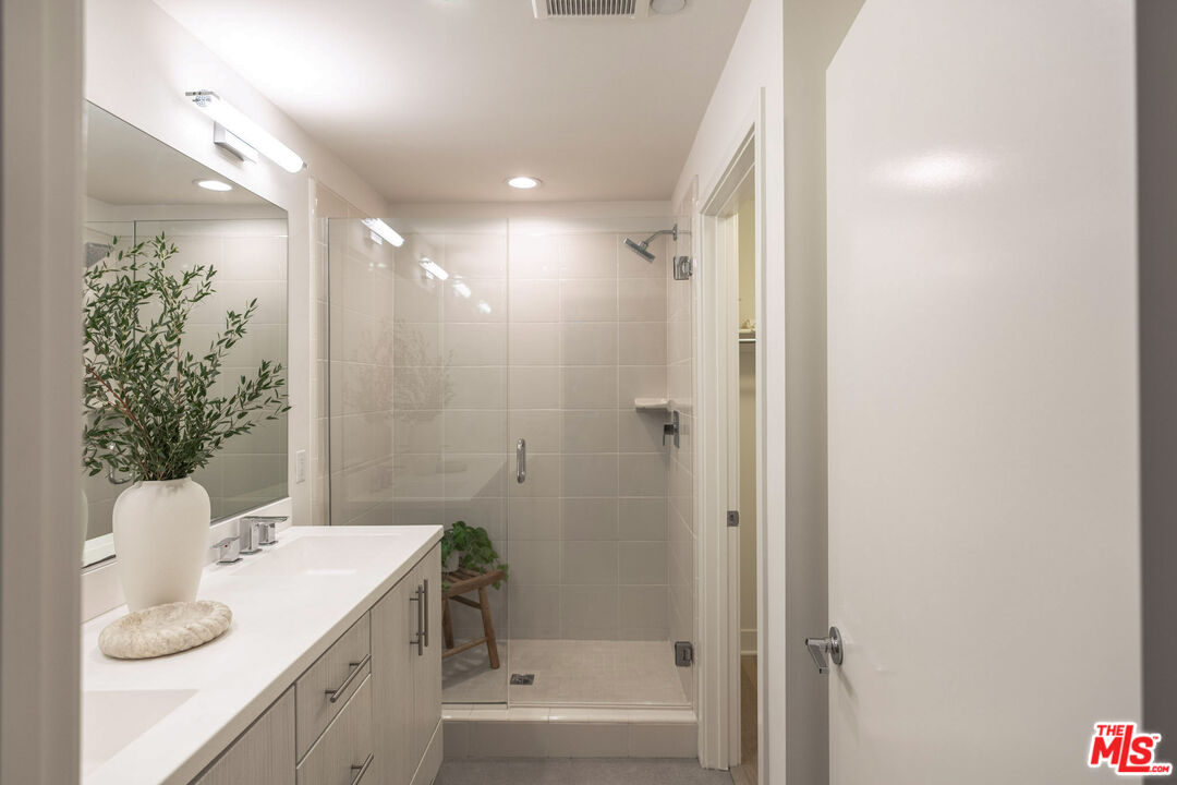 2210 Tom Mix Road Los Angeles, CA 90026 - Photo 24 of 45 a bathroom with a granite countertop sink a toilet and shower