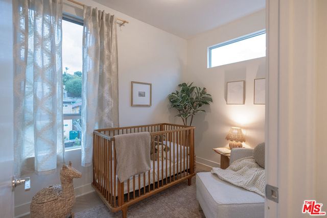 a bedroom with windows