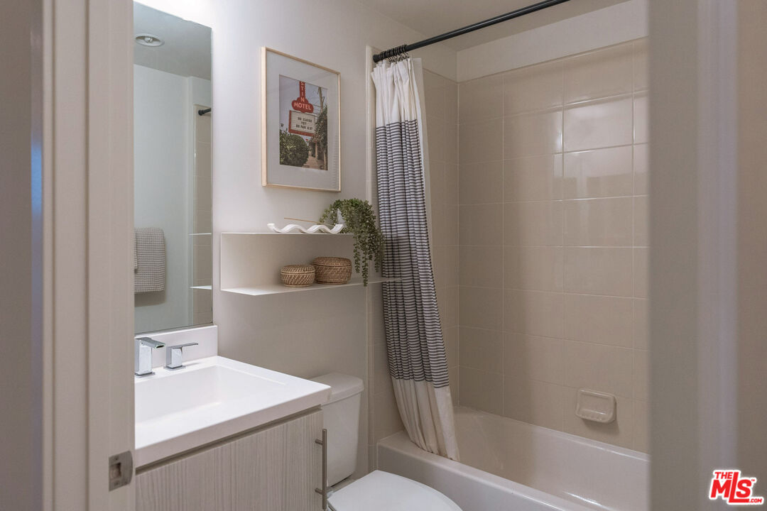 2210 Tom Mix Road Los Angeles, CA 90026 - Photo 33 of 45 a bathroom with a sink a toilet and shower