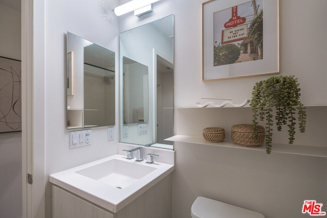 2210 Tom Mix Road Los Angeles, CA 90026 - Photo 34 of 45 a bathroom with a sink and a mirror