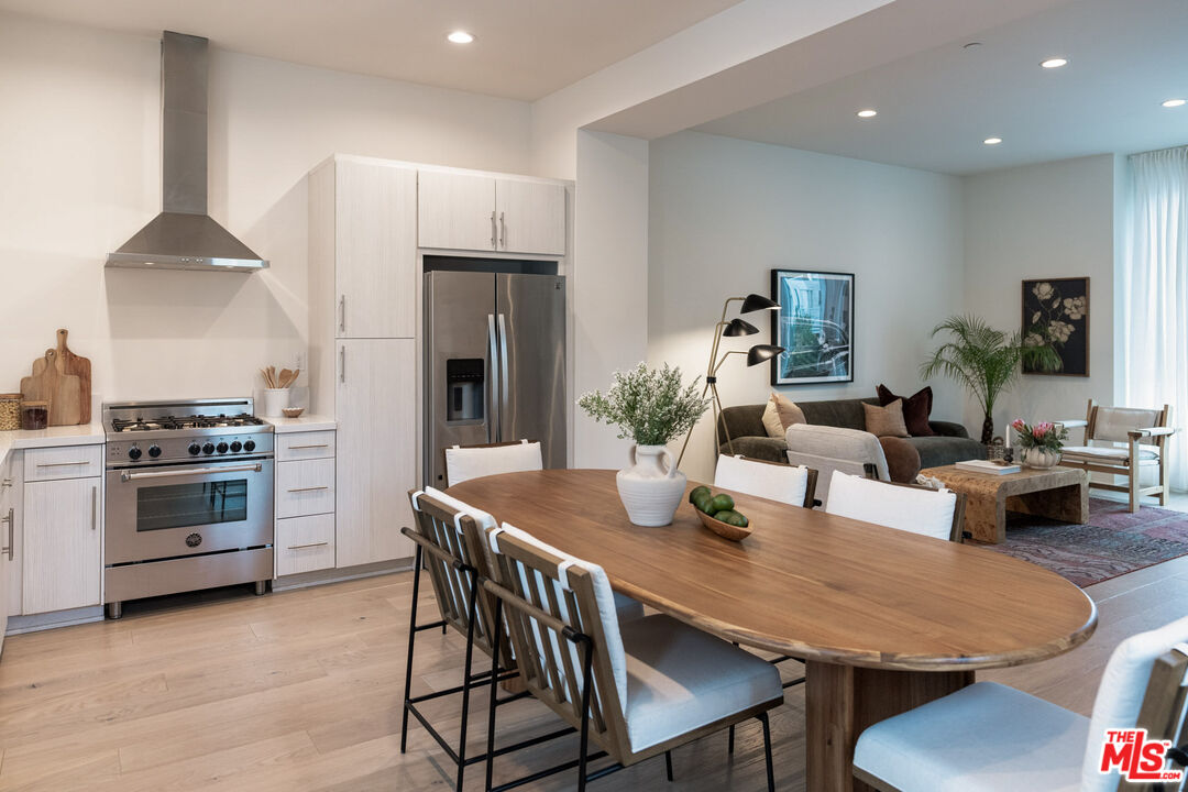 2210 Tom Mix Road Los Angeles, CA 90026 - Photo 7 of 45 a living room with stainless steel appliances furniture a dining table and chairs