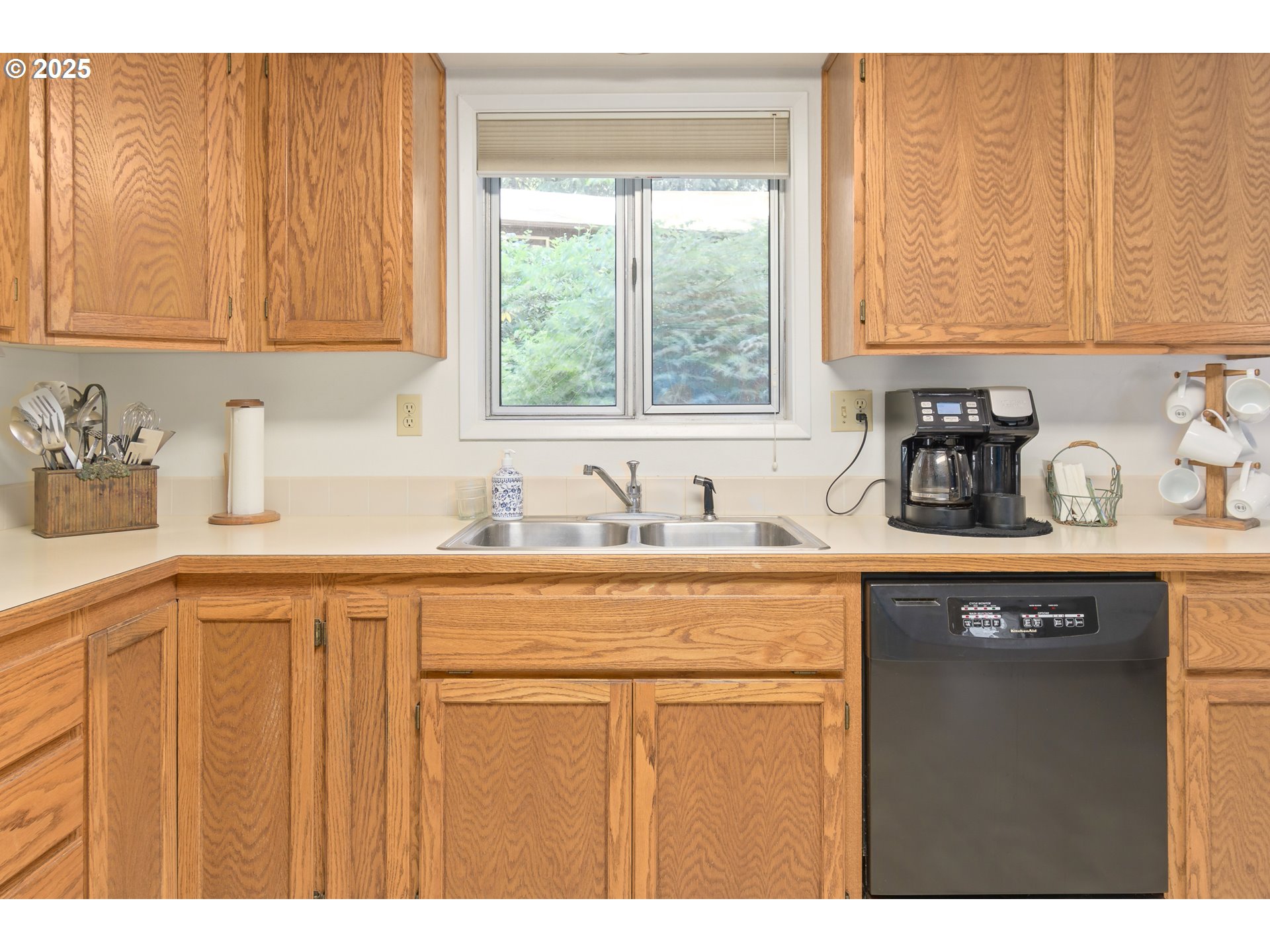 41886 Deerhorn Road Springfield, OR 97478 - Photo 11 of 48 a kitchen with stainless steel appliances granite countertop a sink a window and cabinets