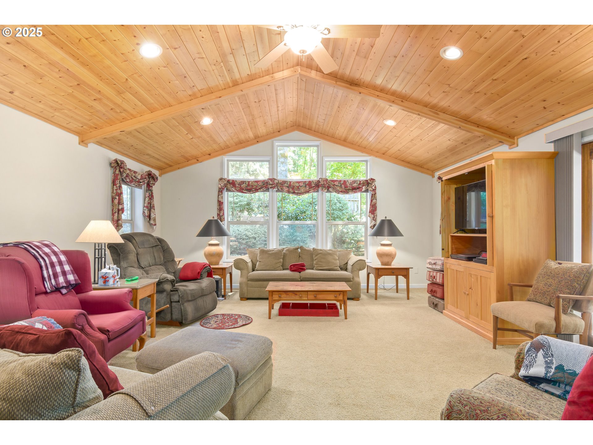 41886 Deerhorn Road Springfield, OR 97478 - Photo 17 of 48 a living room with furniture a large window and a chandelier