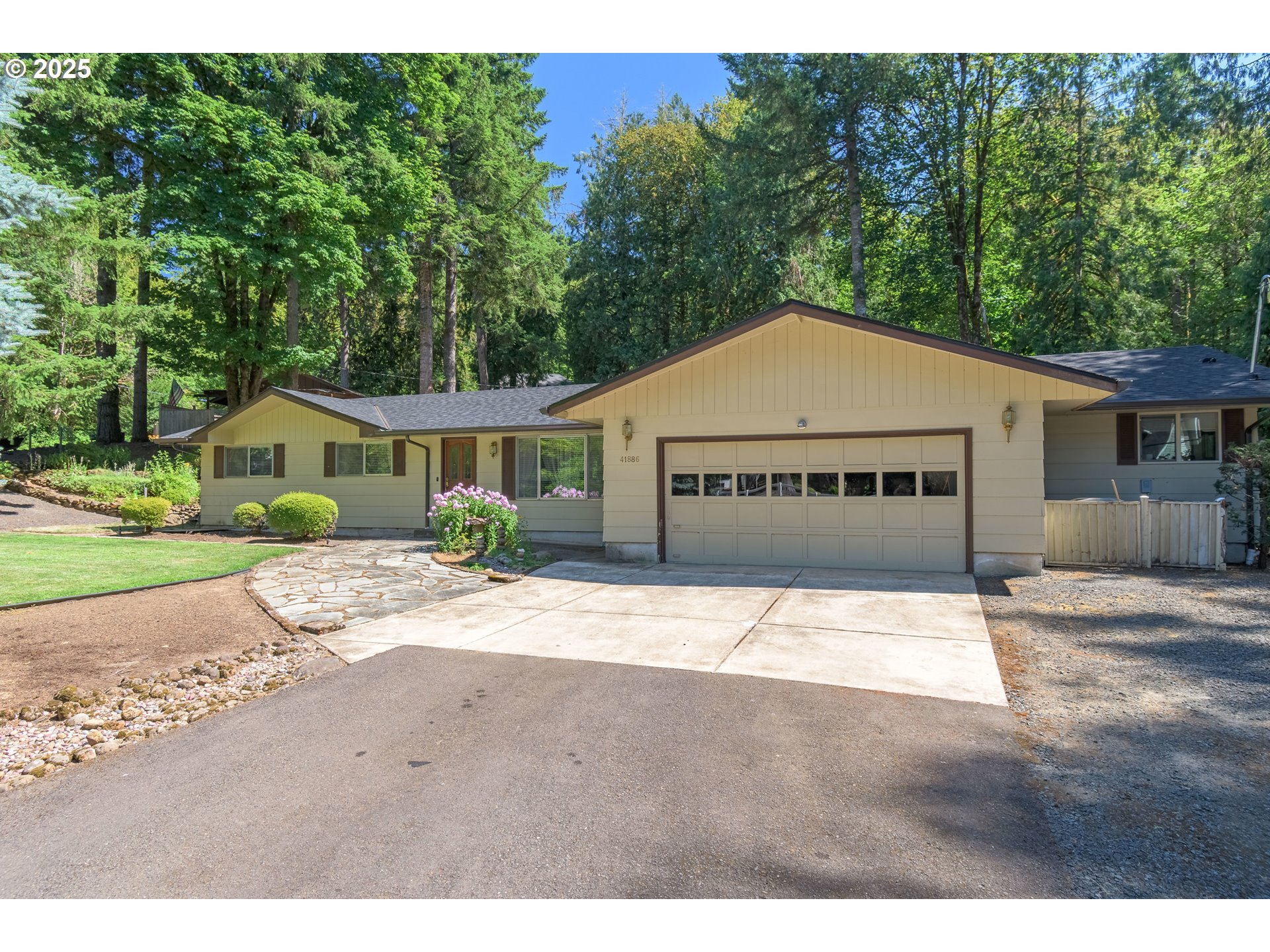 41886 Deerhorn Road Springfield, OR 97478 - Photo 3 of 48 a front view of a house with a yard and garage