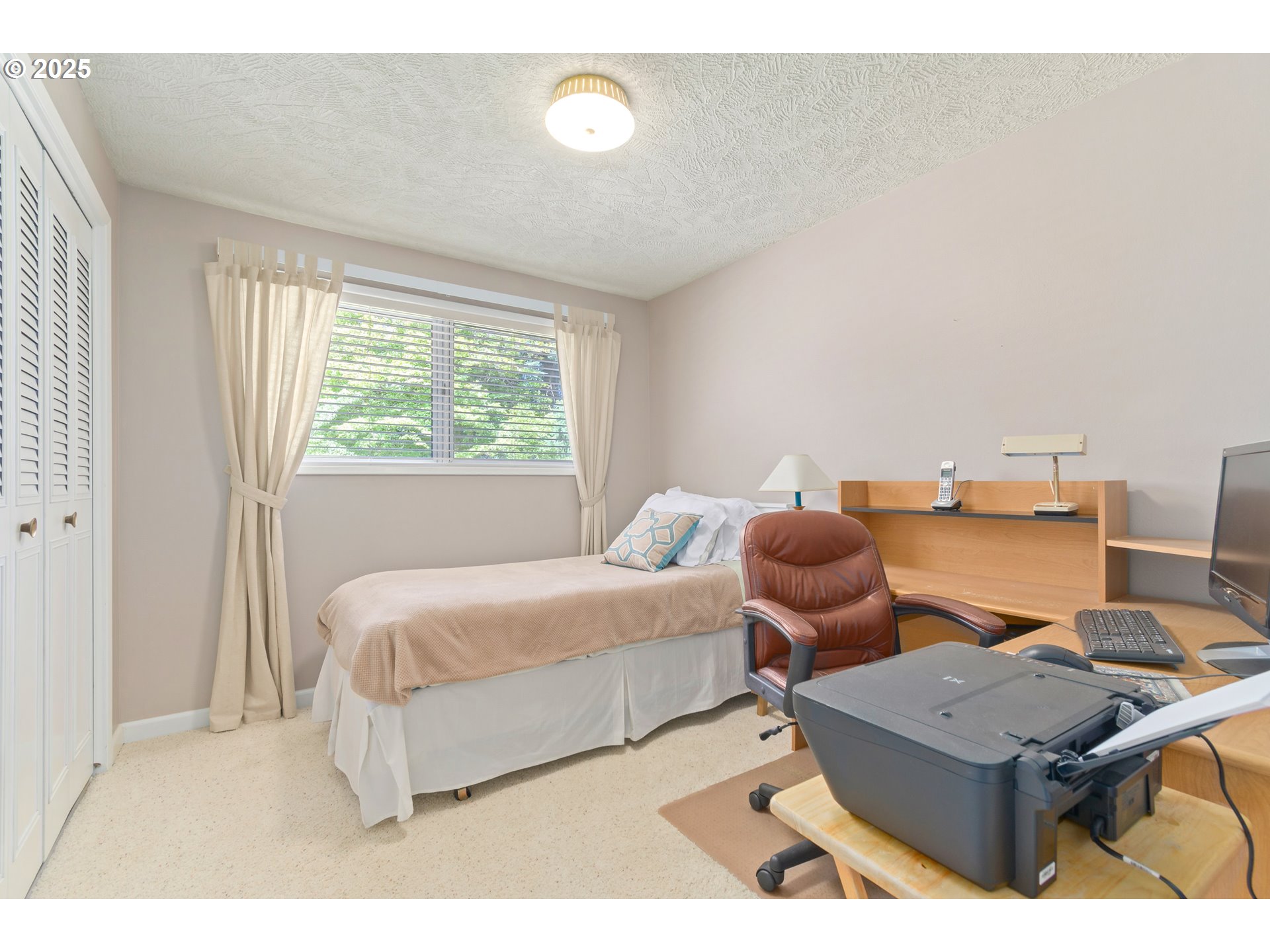 41886 Deerhorn Road Springfield, OR 97478 - Photo 32 of 48 a bedroom with a bed and next to a window