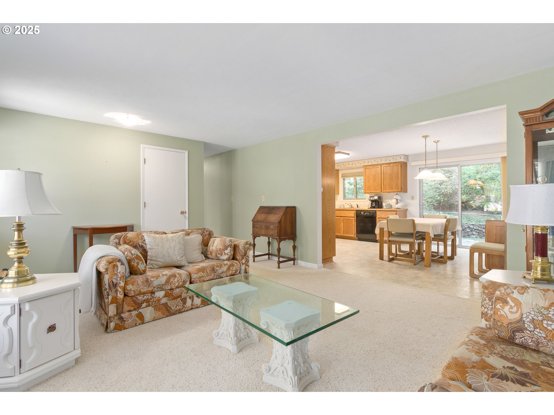 41886 Deerhorn Road Springfield, OR 97478 - Photo 6 of 48 a living room with furniture and a dining table with kitchen view