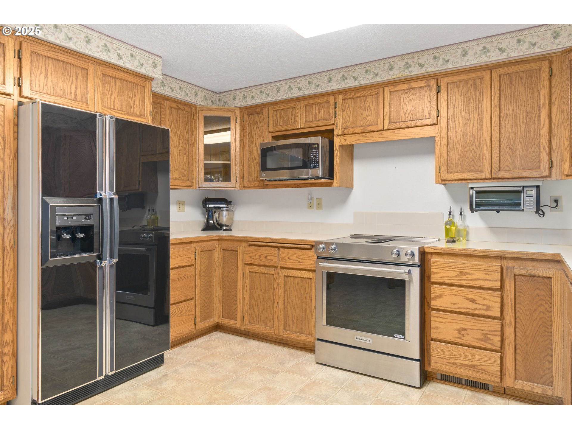 41886 Deerhorn Road Springfield, OR 97478 - Photo 9 of 48 a kitchen with stainless steel appliances granite countertop a refrigerator stove and sink