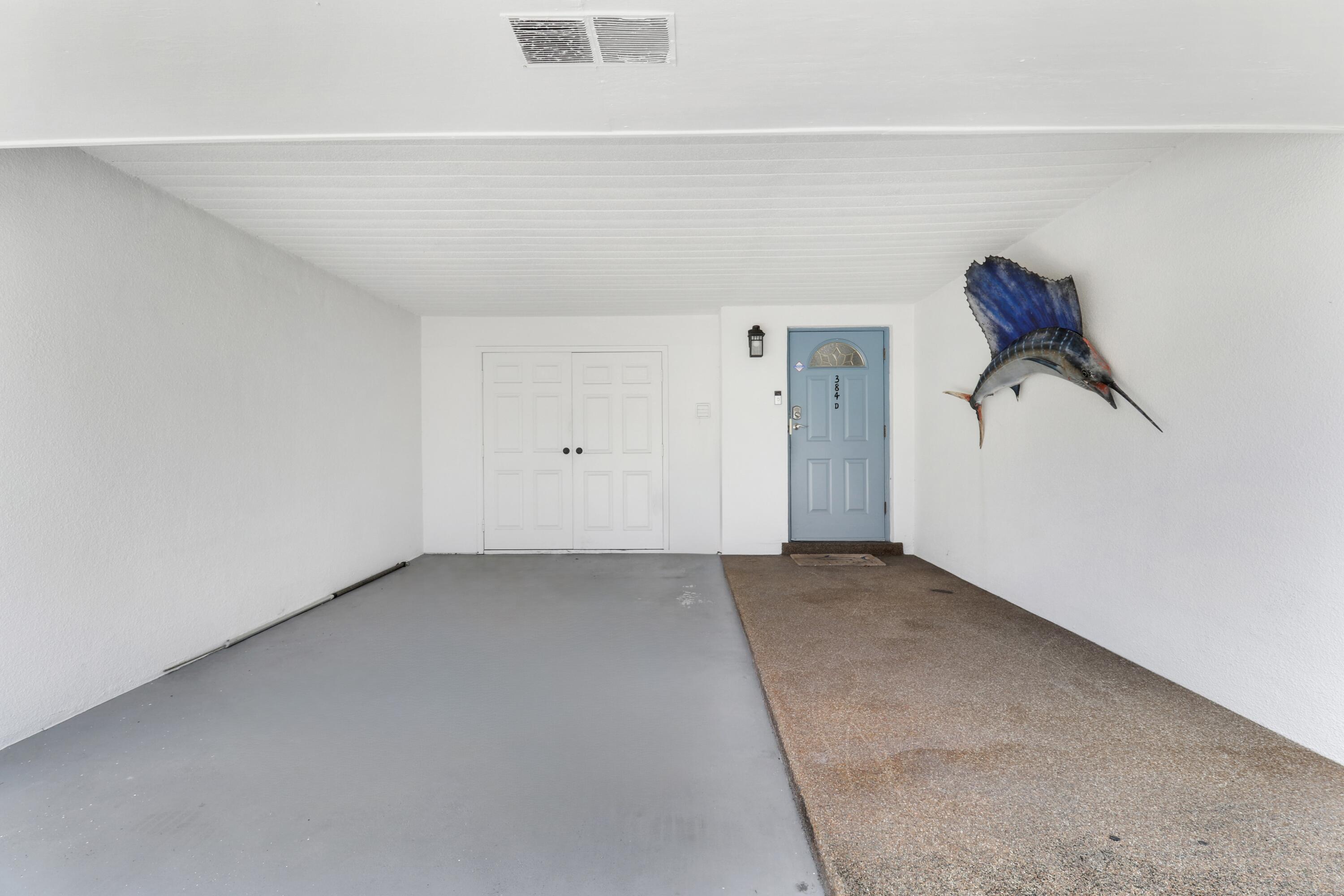 384 Golfview Road, Unit D North Palm Beach, FL 33408 - Photo 2 of 52 Carport & Storage Room