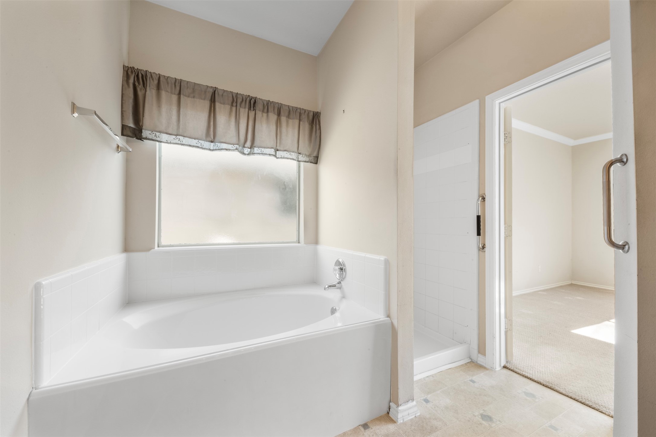 1839 Manor Drive Baytown, TX 77521 - Photo 12 of 26 a bathroom with a bathtub and a shower