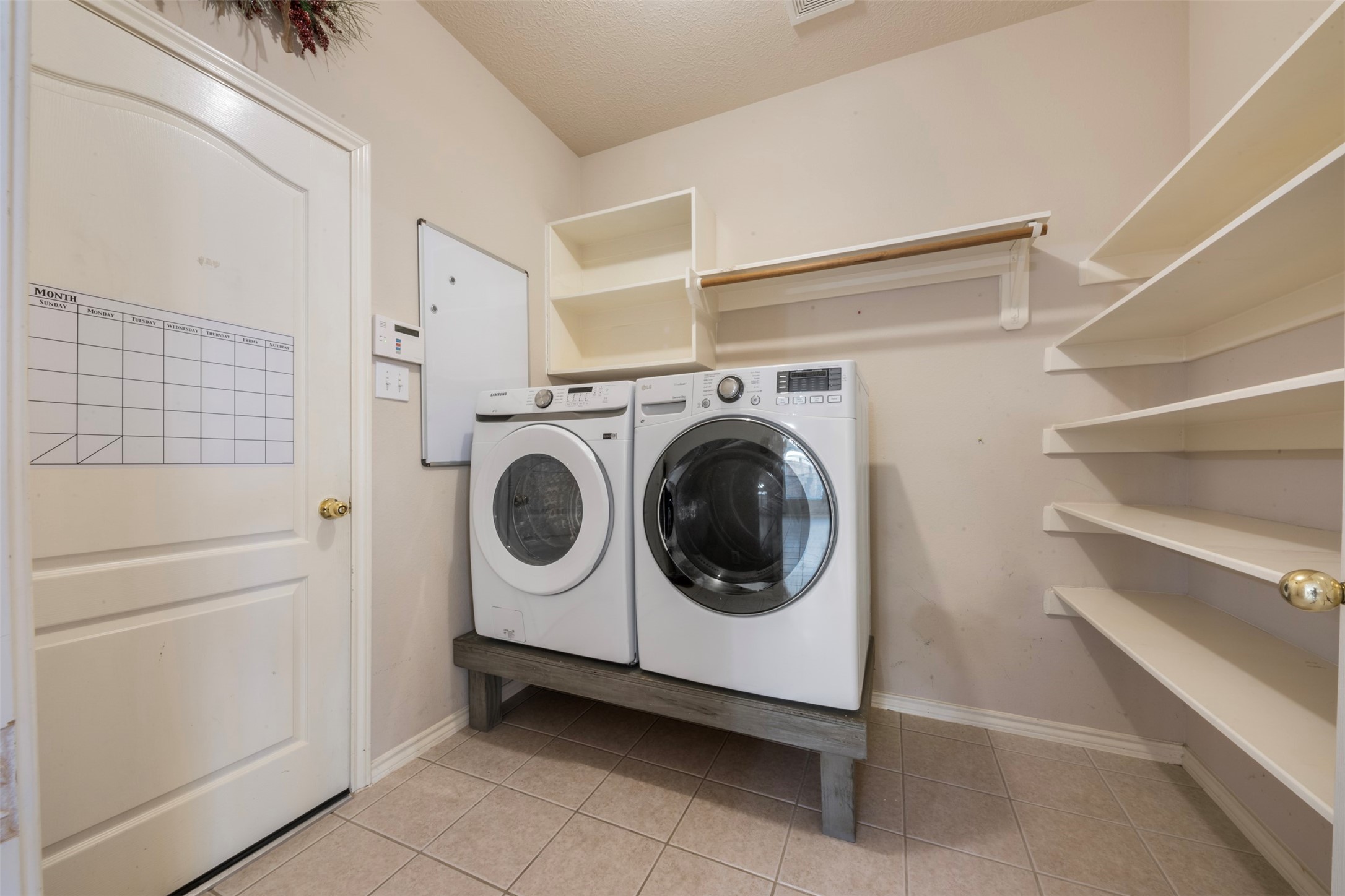 1839 Manor Drive Baytown, TX 77521 - Photo 14 of 26 a utility room with dryer and washer
