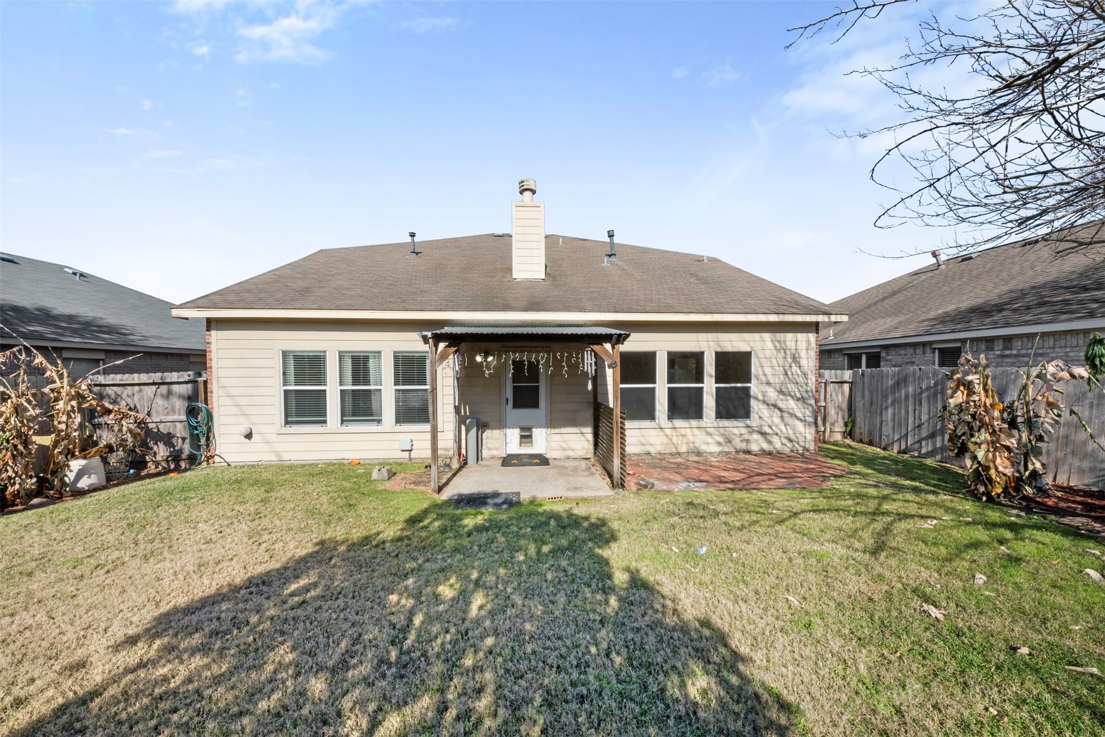1839 Manor Drive Baytown, TX 77521 - Photo 18 of 26 a front view of a house with a garden and yard