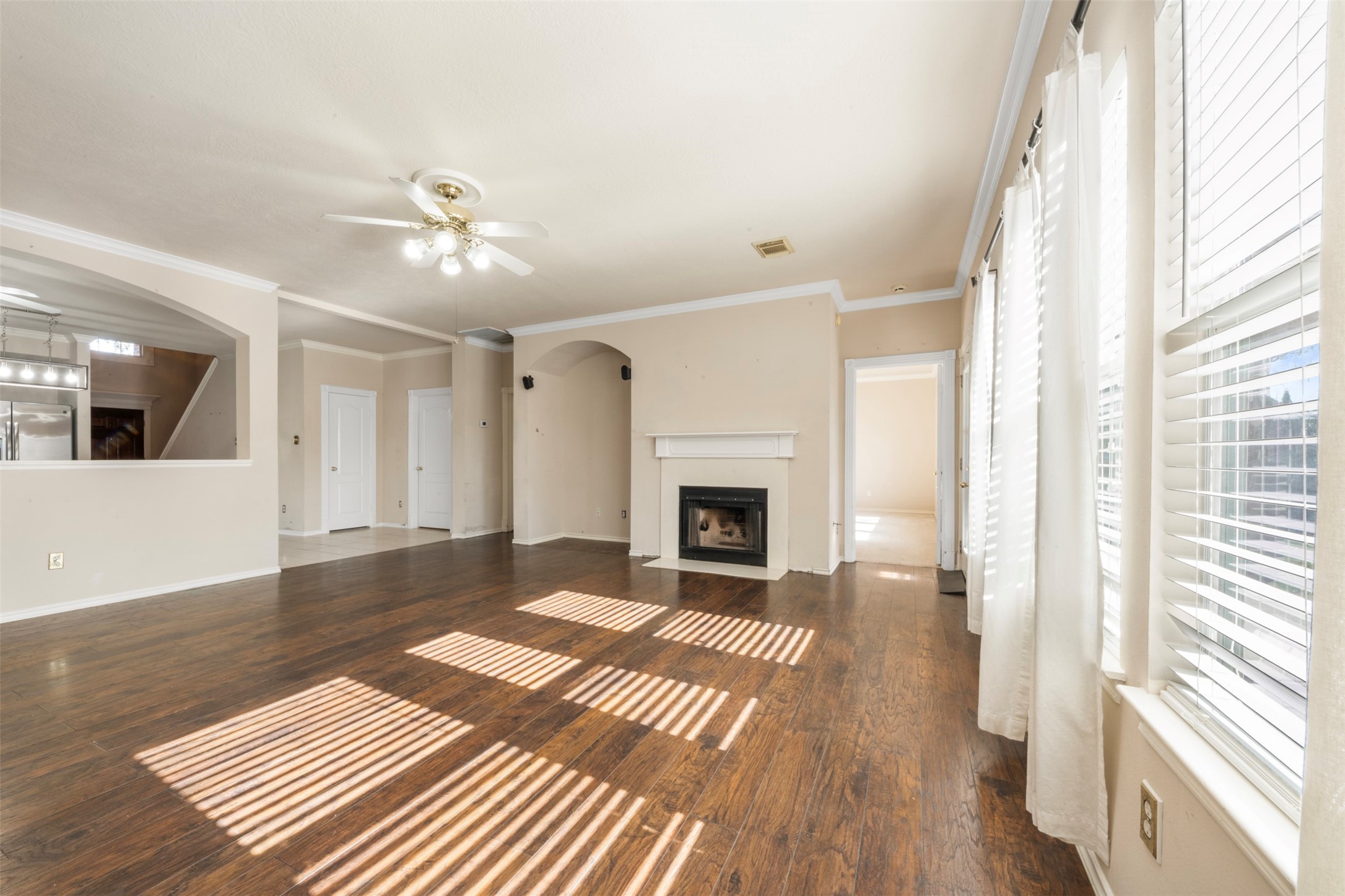 1839 Manor Drive Baytown, TX 77521 - Photo 5 of 26 a view of a livingroom with wooden floor and a fireplace