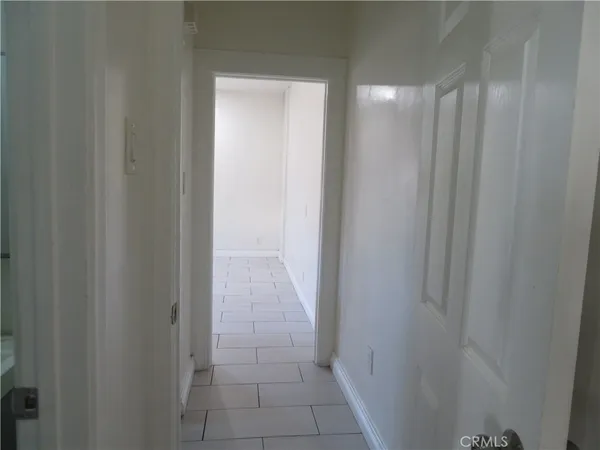 a view of cabinets and wooden floor