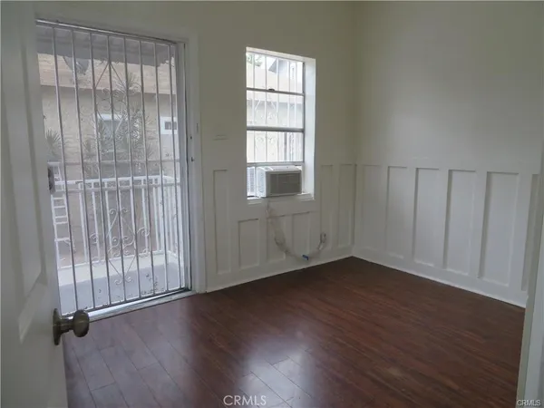 a view of cabinets and wooden floor