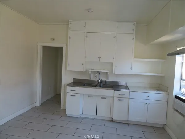 a kitchen with a sink and cabinets