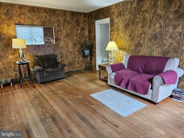 a living room with furniture fireplace and a flat screen tv