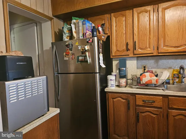 a view of a hallway with furniture