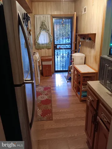 a stove top oven sitting inside of a kitchen