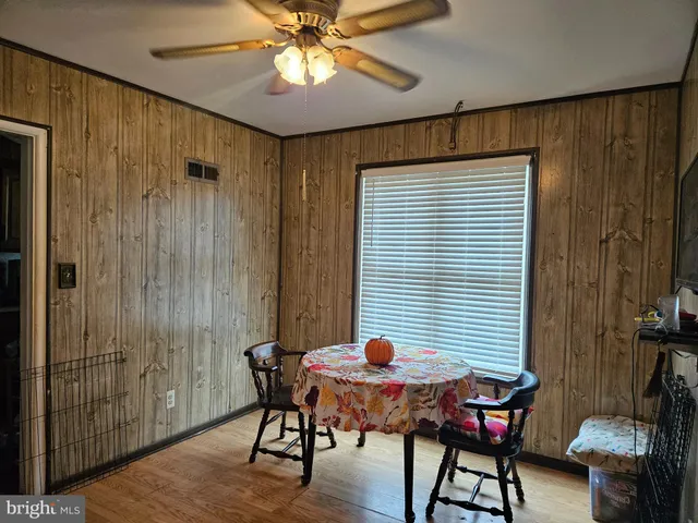 a spacious bedroom with a bed and a chandelier