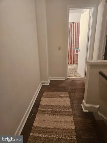 a close up of a storage and utility room with a refrigerator