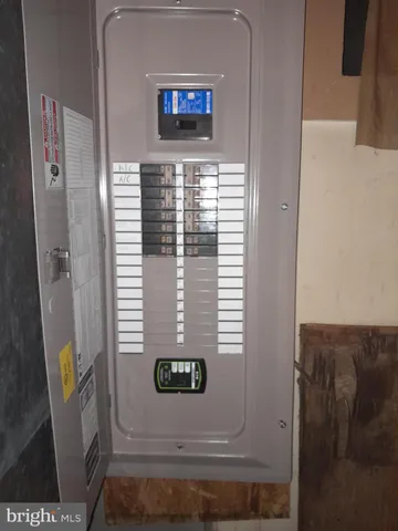a view of a chairs and backyard with wooden fence