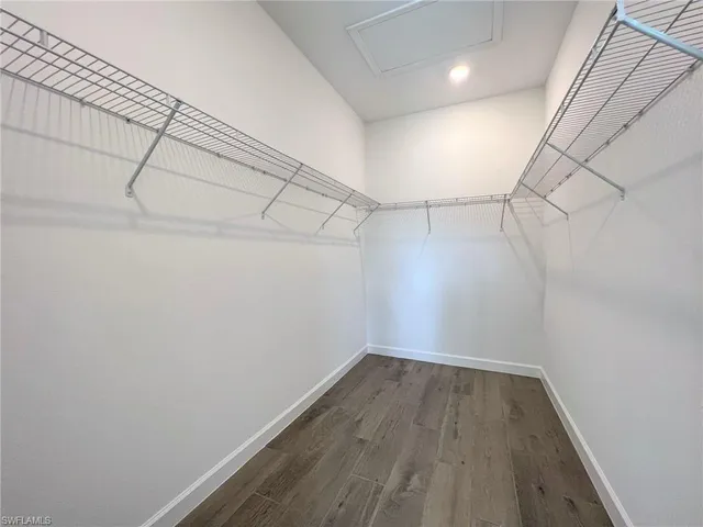 a view of a livingroom with a ceiling fan and window