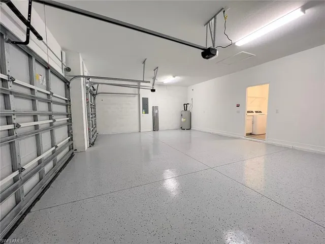 a spacious bathroom with a double vanity sink and mirror