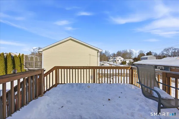a view of a balcony with furniture