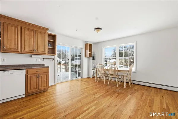 a view of a kitchen with dining table and chairs