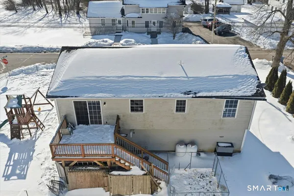 an aerial view of a house with yard