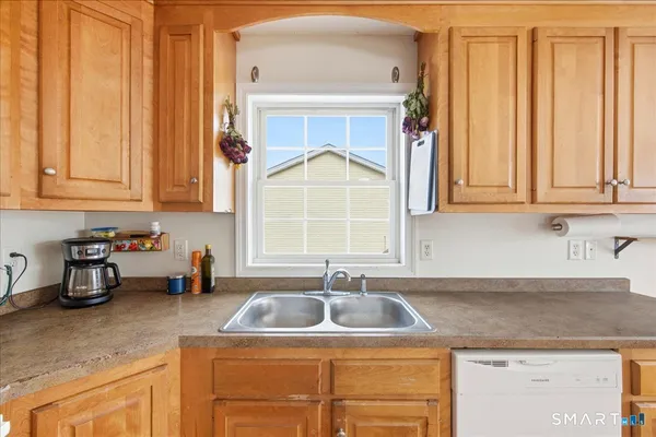 a kitchen with a sink cabinets and a granite counter top