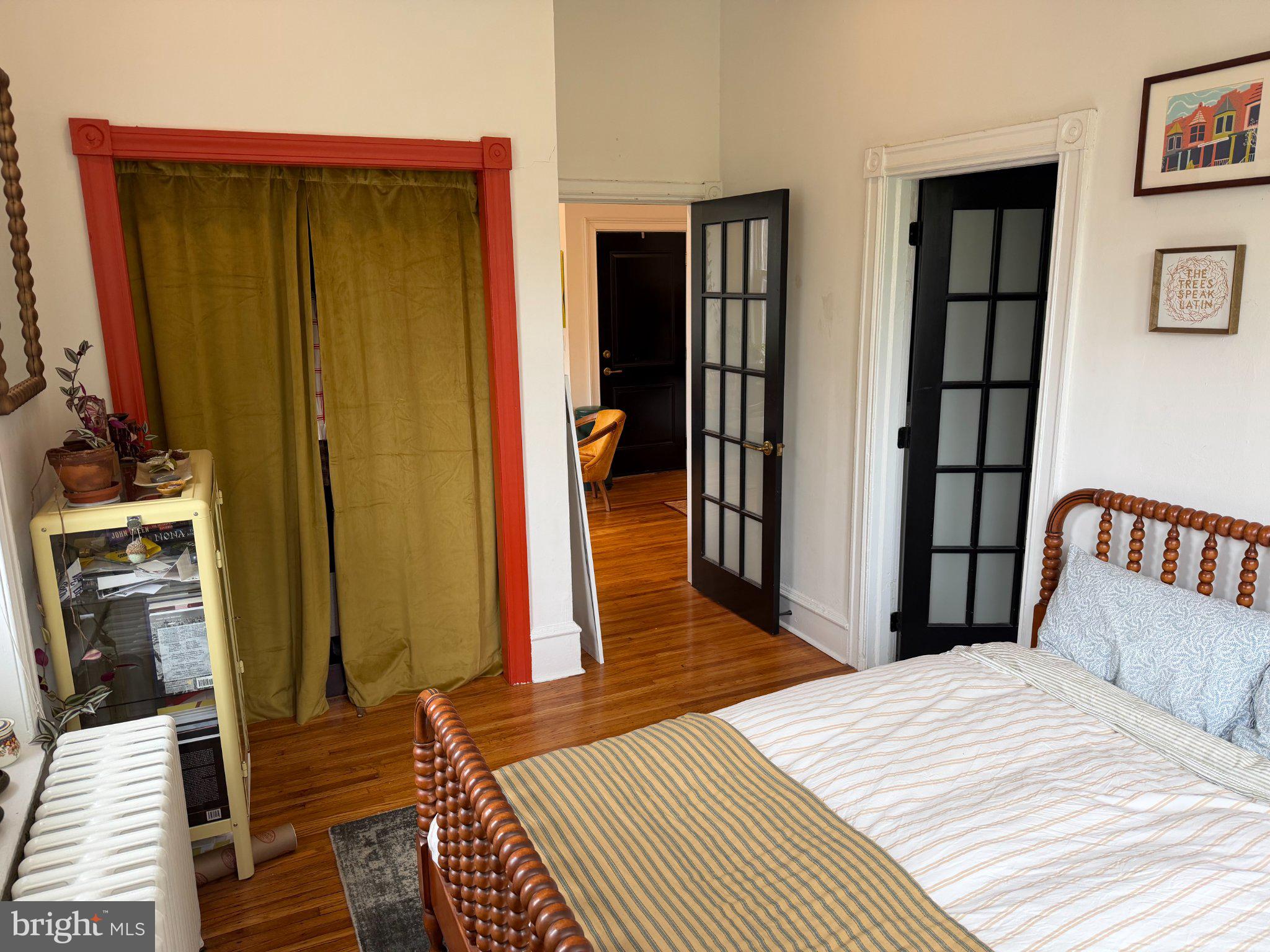 815 South 49th Street Philadelphia, PA 19143 - Photo 33 of 72 a bedroom with a bed and a mirror