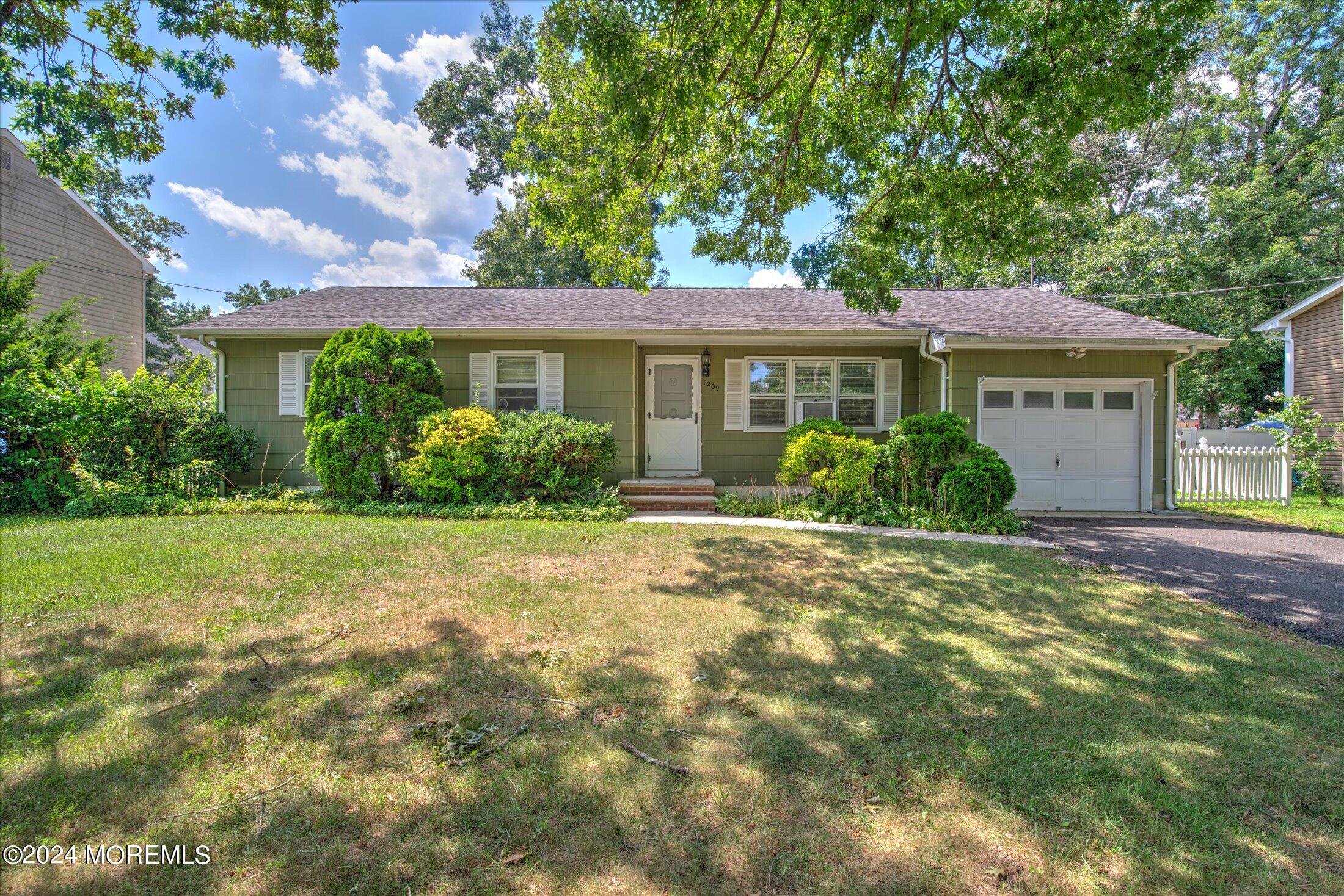 2209 Glen Oak Drive Forked River, NJ 08731 - Photo 1 of 44 a front view of a house with garden