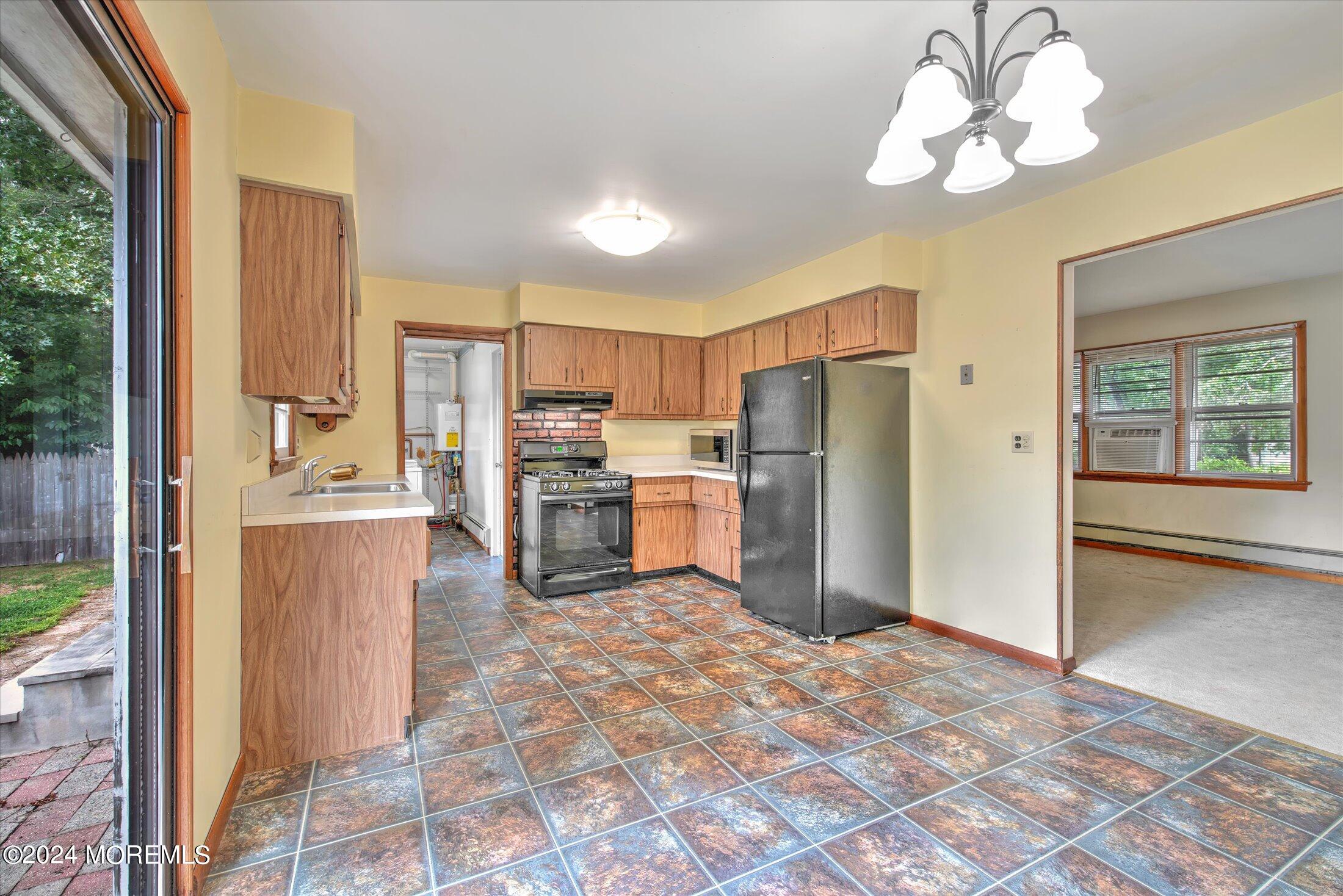 2209 Glen Oak Drive Forked River, NJ 08731 - Photo 11 of 44 a kitchen with refrigerator and cabinets